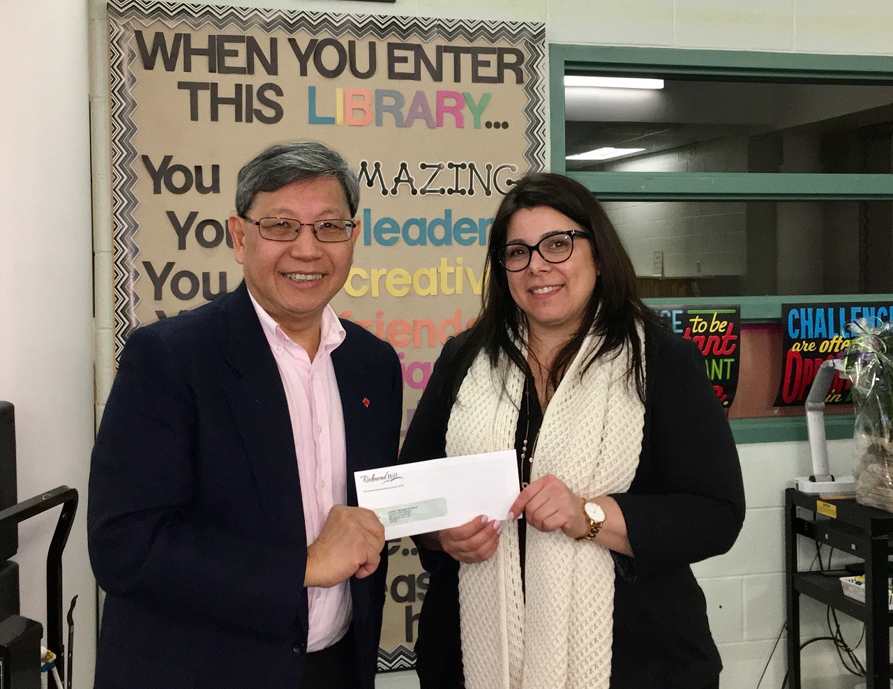 Godwin Chan Presenting donation to local School